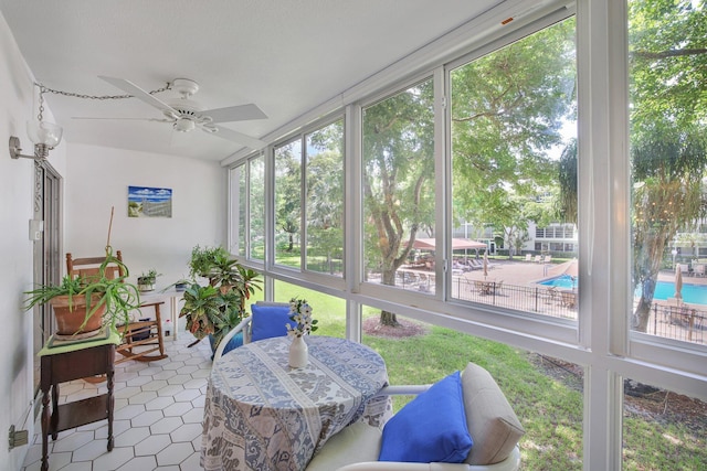 sunroom with ceiling fan