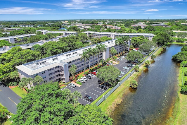 2004 Granada Dr Unit L2, Coconut Creek, FL 33066 - drone / aerial view of a nearby body of water and a tree filled landscape