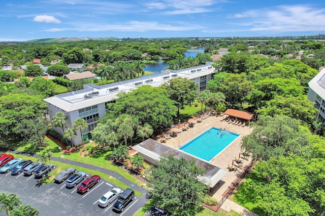 2004 Granada Dr Unit L2, Coconut Creek, FL 33066 - bird's eye view of a large body of water, a pool, and a tree filled landscape