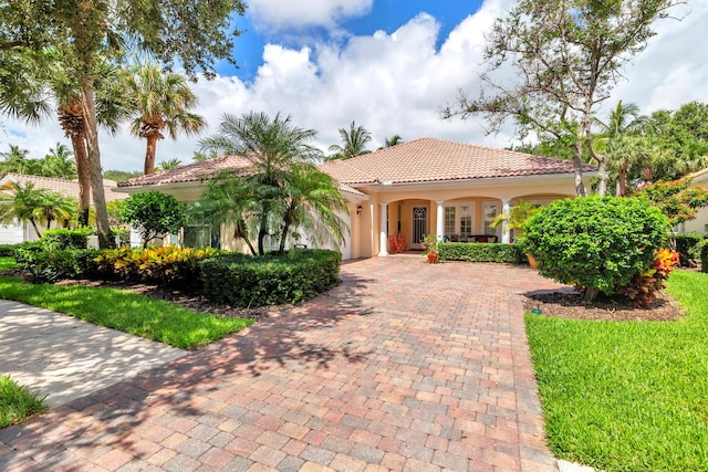 mediterranean / spanish house with a porch