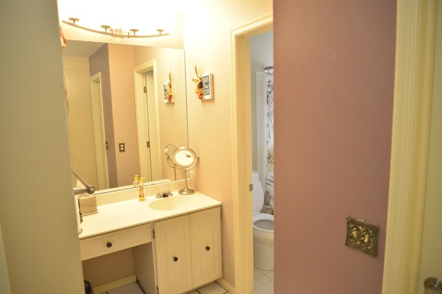 bathroom featuring vanity, toilet, and tile patterned floors