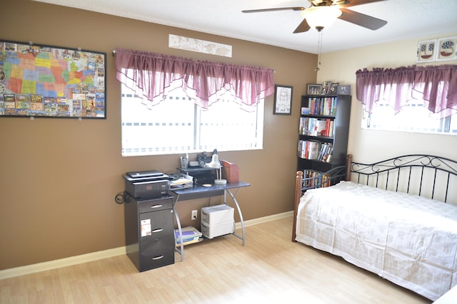 bedroom featuring ceiling fan and wood-type flooring