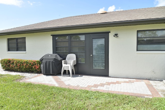 property entrance with a patio