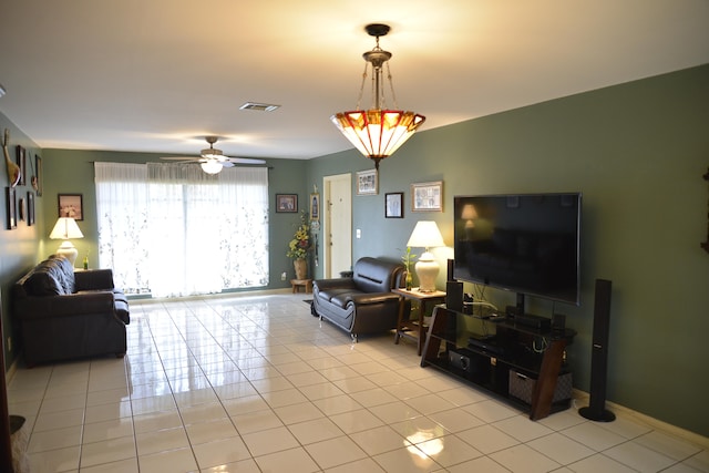 living room with light tile patterned floors and ceiling fan