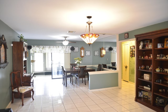 dining room with light tile patterned flooring and ceiling fan