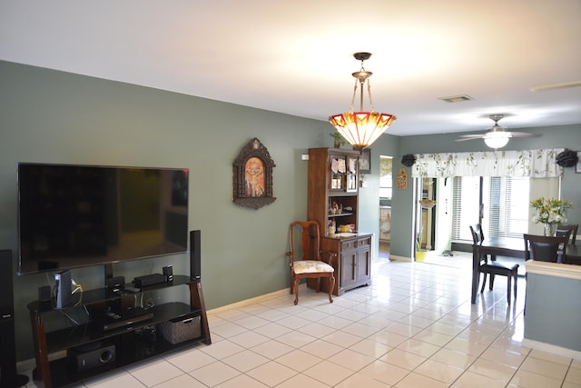 tiled living room featuring ceiling fan