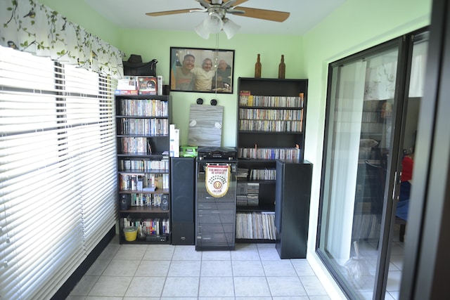 unfurnished office featuring light tile patterned flooring and ceiling fan