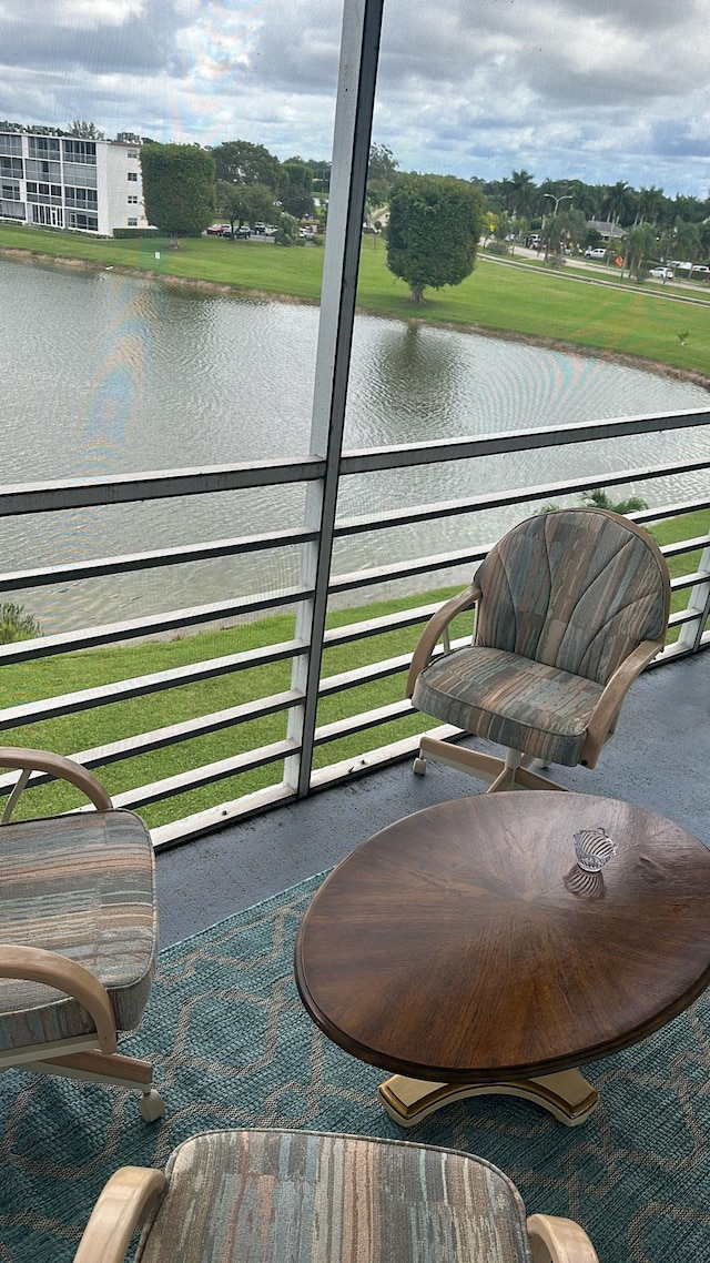 balcony featuring a water view