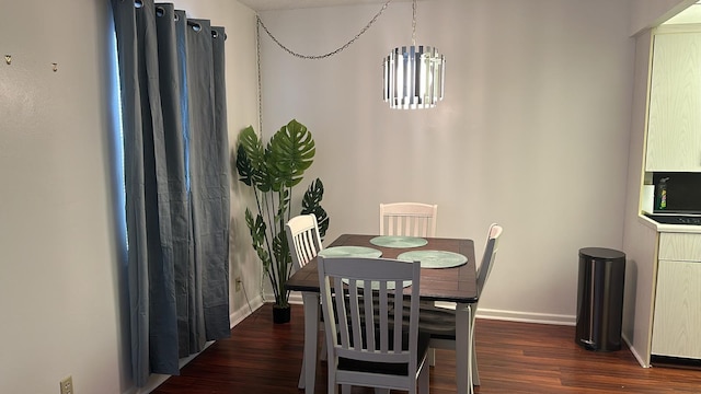 dining space featuring dark hardwood / wood-style floors