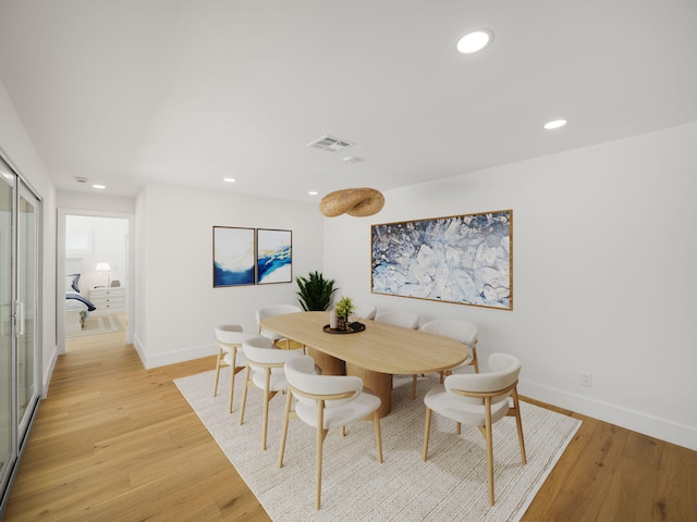 dining space featuring light wood-type flooring