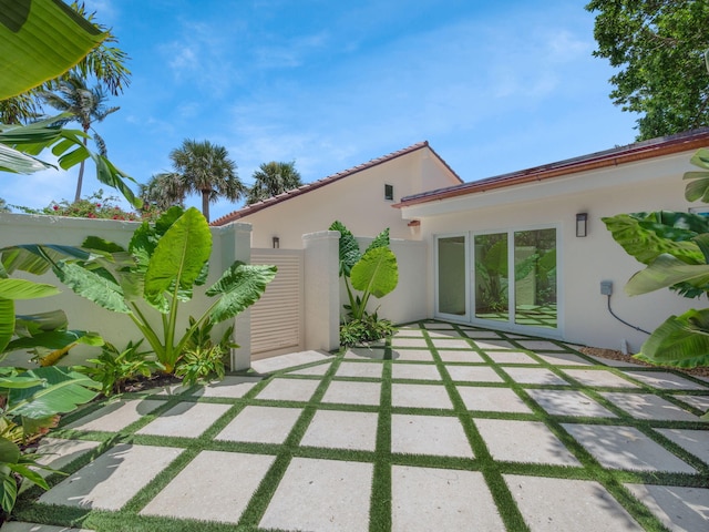 back of property with a patio area