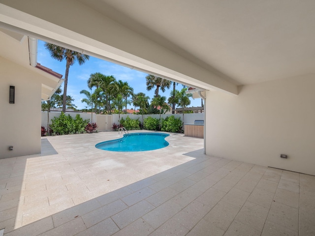 view of swimming pool featuring a patio