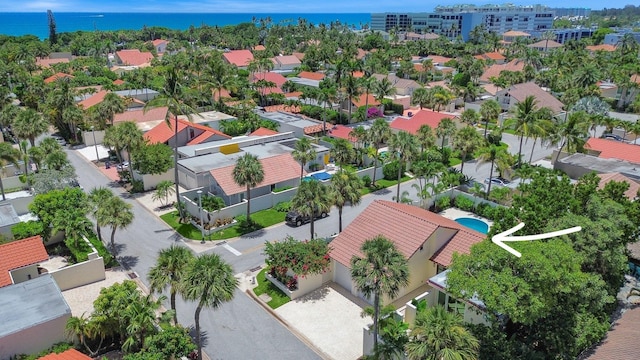 birds eye view of property featuring a water view