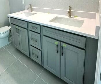 bathroom with tile patterned floors, vanity, and toilet