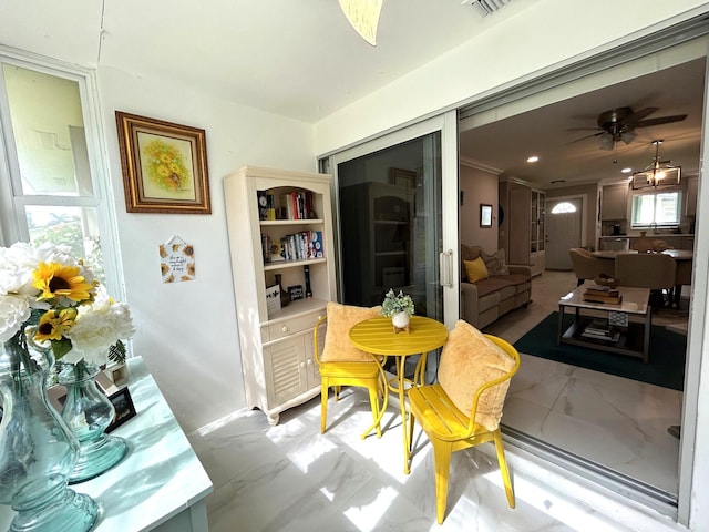 dining area featuring plenty of natural light and ceiling fan