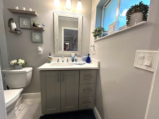 bathroom featuring toilet and vanity