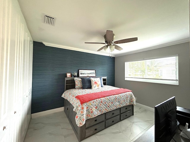 bedroom with a closet, ceiling fan, and crown molding