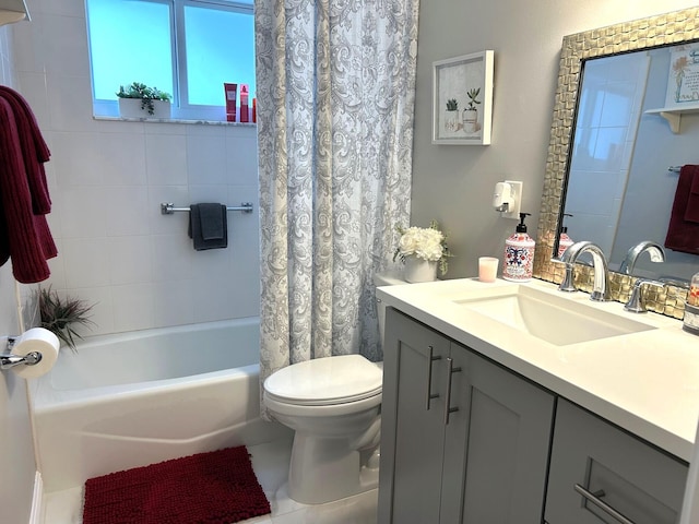 full bathroom with shower / bath combo with shower curtain, tile patterned floors, toilet, and vanity