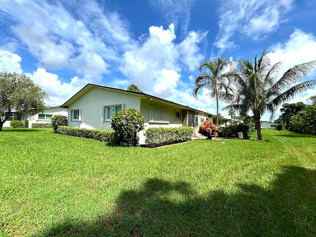 view of home's exterior featuring a lawn