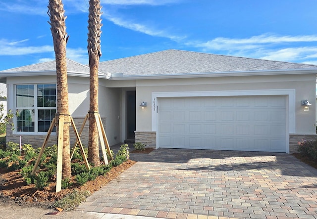 ranch-style home featuring a garage