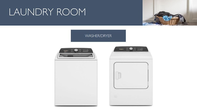 washroom with washer and dryer