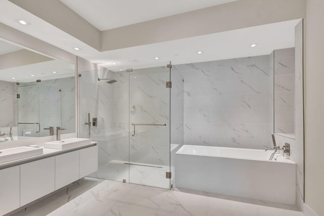 bathroom featuring separate shower and tub and vanity