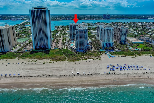 aerial view with a water view and a view of the beach