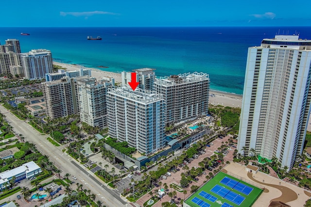 bird's eye view featuring a water view and a beach view