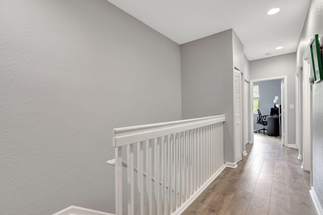 hall with light hardwood / wood-style flooring