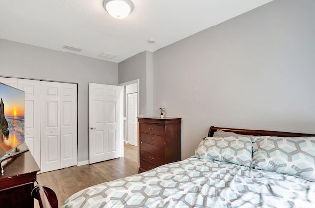 bedroom featuring a closet and hardwood / wood-style floors