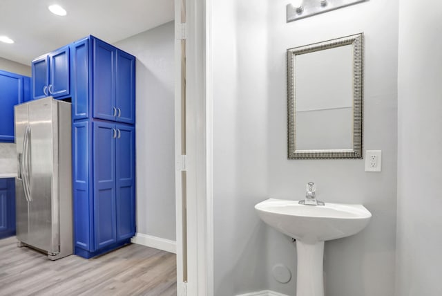 bathroom featuring wood-type flooring