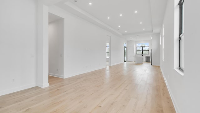 unfurnished living room with light hardwood / wood-style floors