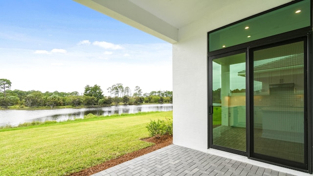 view of patio featuring a water view