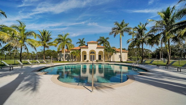 view of swimming pool featuring a patio area