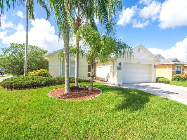 view of front of house featuring a front lawn and a garage