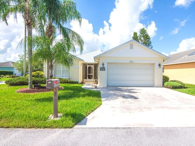 single story home featuring a front yard and a garage