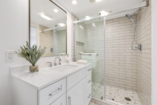 bathroom featuring vanity and walk in shower