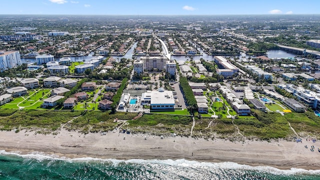 birds eye view of property featuring a view of the beach and a water view