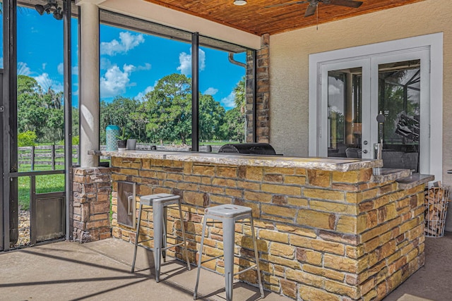 view of patio with ceiling fan and french doors