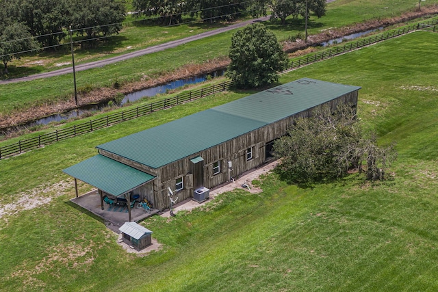 drone / aerial view with a rural view and a water view