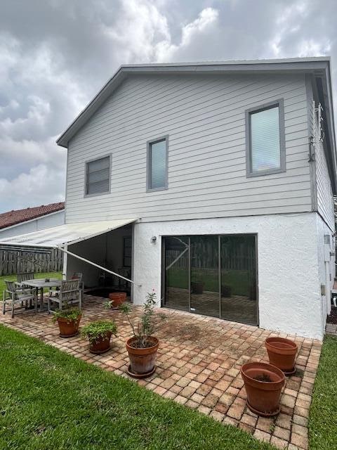 back of house featuring a patio