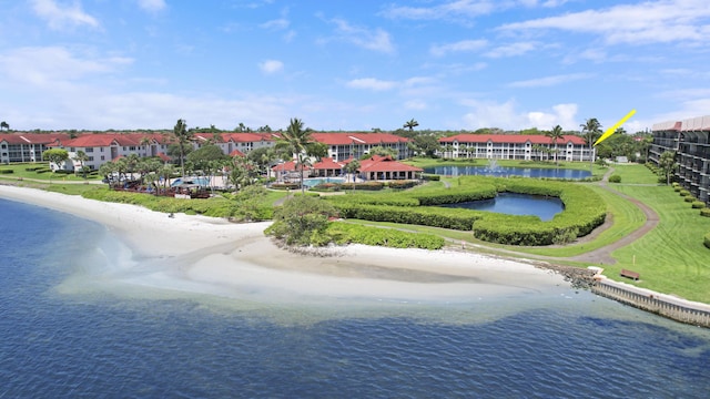 bird's eye view featuring a beach view and a water view