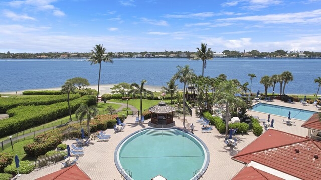 view of swimming pool featuring a gazebo and a water view