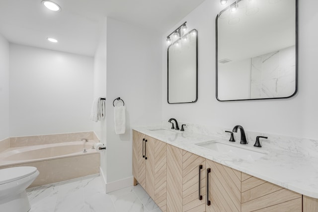 bathroom with a bathing tub, vanity, and toilet