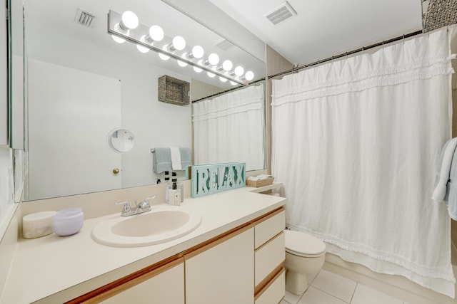 full bathroom with tile patterned flooring, shower / bath combo, vanity, and toilet