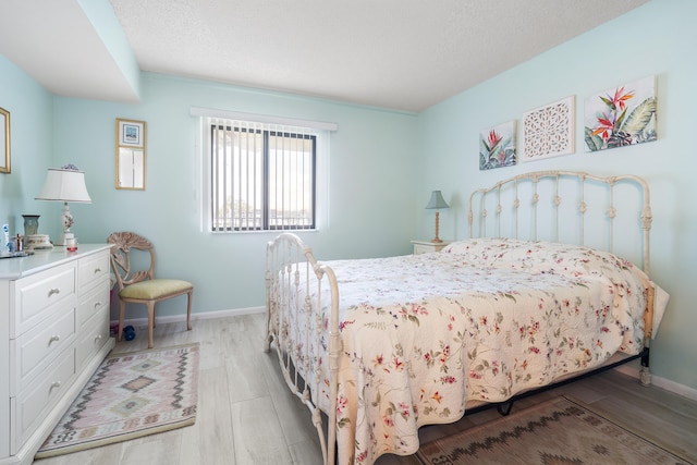 bedroom with light hardwood / wood-style floors