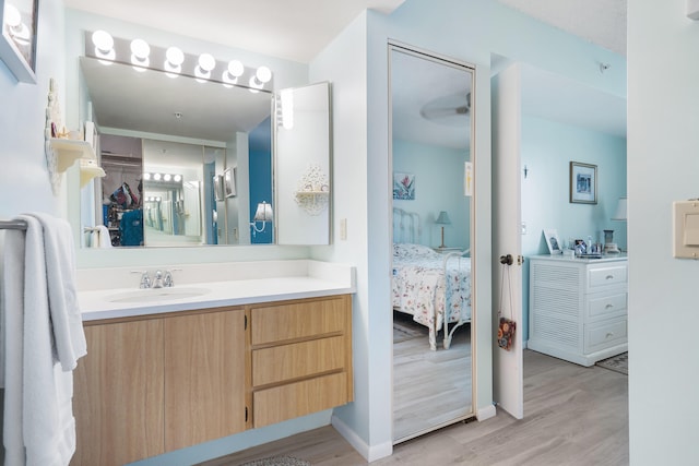 bathroom featuring hardwood / wood-style flooring and vanity