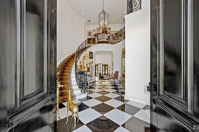 entrance foyer featuring a chandelier