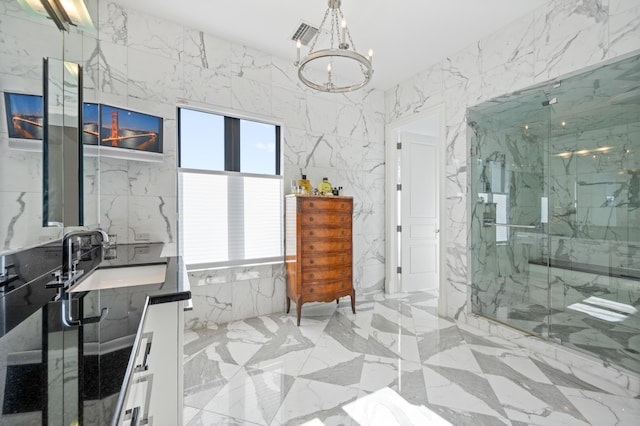 bathroom featuring vanity, an enclosed shower, a notable chandelier, and tile walls