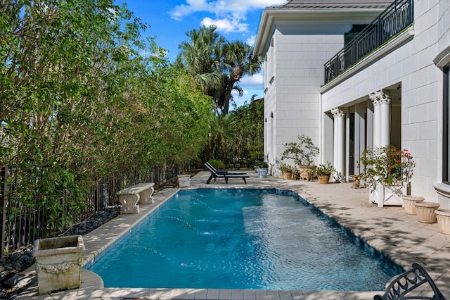 view of swimming pool with a patio